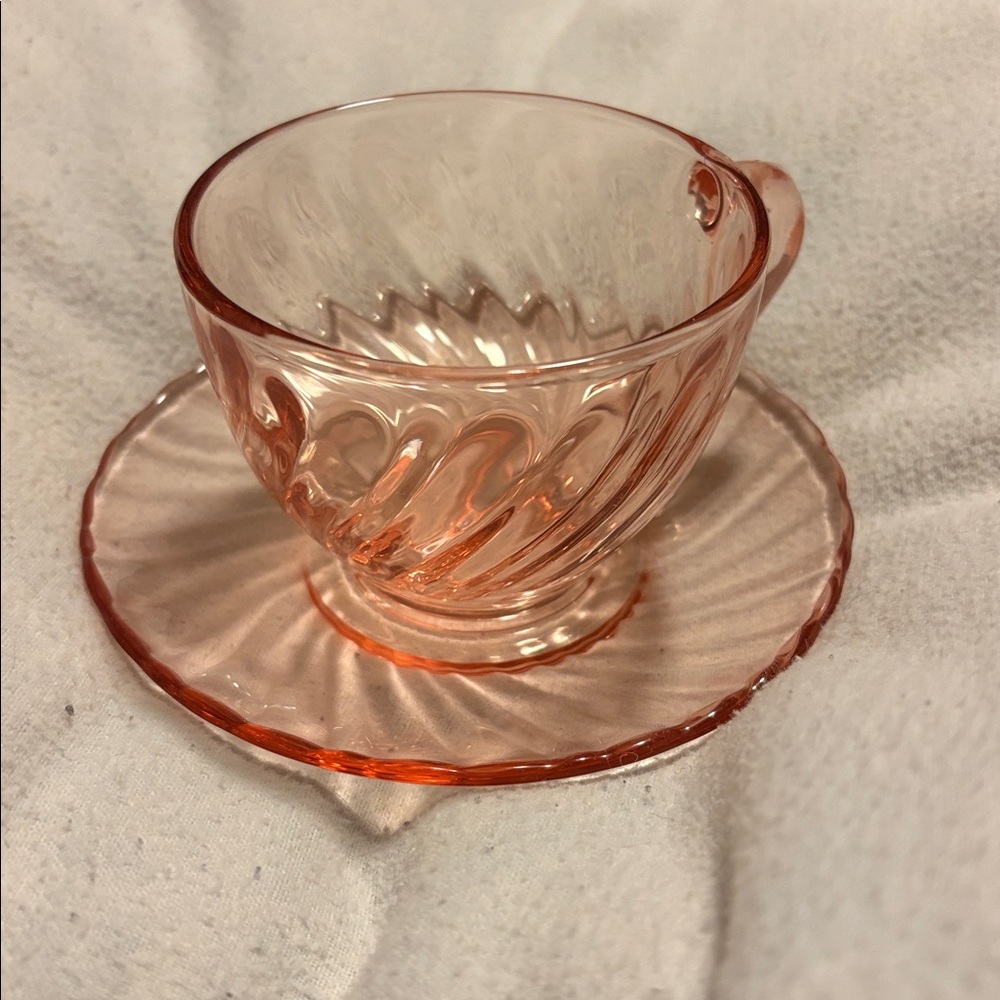 Vintage pink glass teacup and saucer